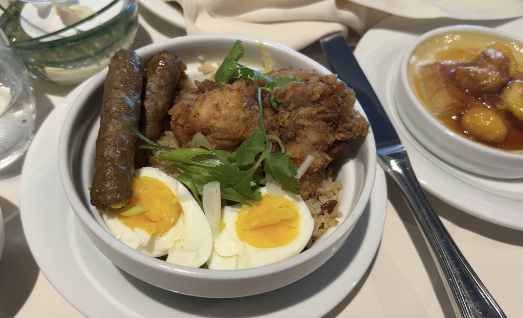 Bowl of karage fried chicken with eggs and rice at breakfast