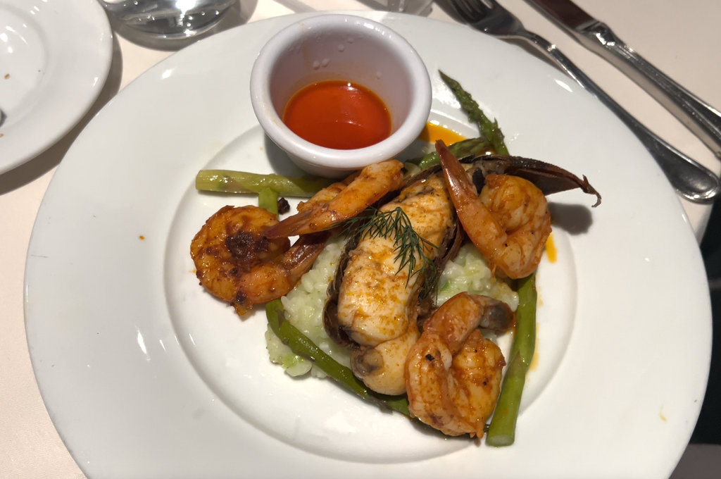 Grilled shrimp and lobster on risotto with asparagus